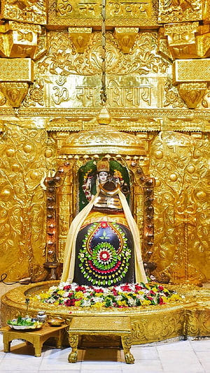 Somnath Mahadev Temple Shiva Lingam with Ornate Gold Carvings and Floral Offerings HD phone wallpaper