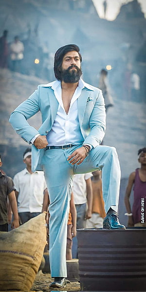 Allu Arjun in a light blue suit from Pushpa 2 The Rule movie still HD phone wallpaper