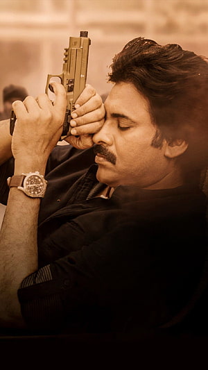 Pawan Kalyan Aiming Pistol in Dramatic Sepia Tone Action Scene HD phone wallpaper