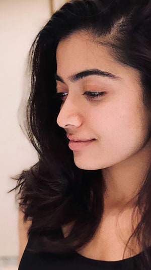 Rashmika Mandanna Soft Profile Portrait With Dark Wavy Hair HD phone wallpaper