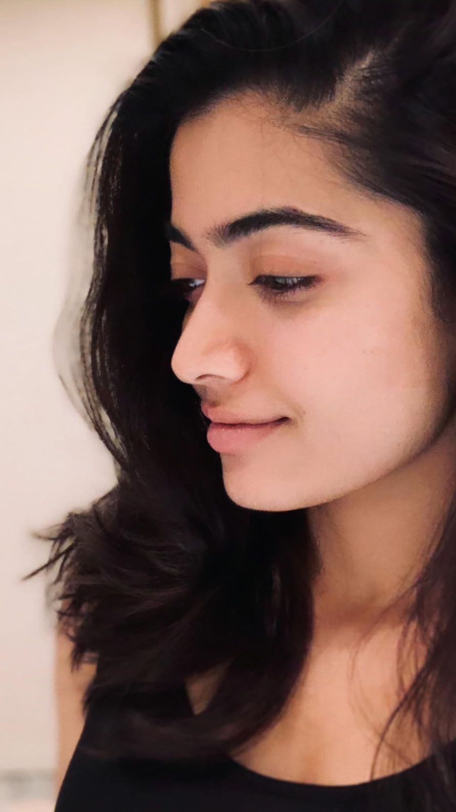 Rashmika Mandanna Soft Profile Portrait With Dark Wavy Hair HD phone wallpaper