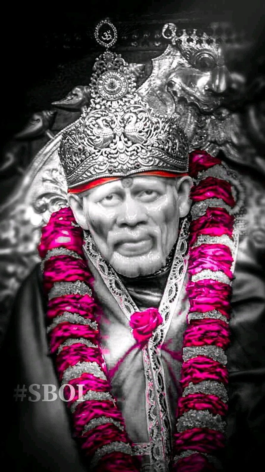 Sai Baba Portrait with Ornate Crown and Vibrant Pink Floral Garland HD phone wallpaper