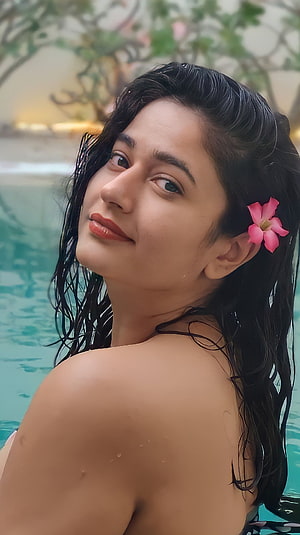 Poonam Bajwa Portrait With Tropical Flower In Hair By The Pool HD phone wallpaper