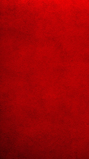 Vibrant Red Textured Background With Subtle Grain And Soft Lighting For Desktop HD phone wallpaper