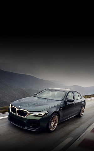 BMW M5 CS High Performance Sedan Driving on a Mountain Road HD phone wallpaper