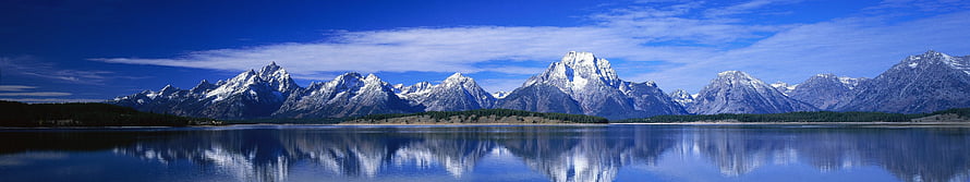 Snow-Capped Mountain Range Reflected in a Calm Alpine Lake Under a Blue Sky HD wallpaper