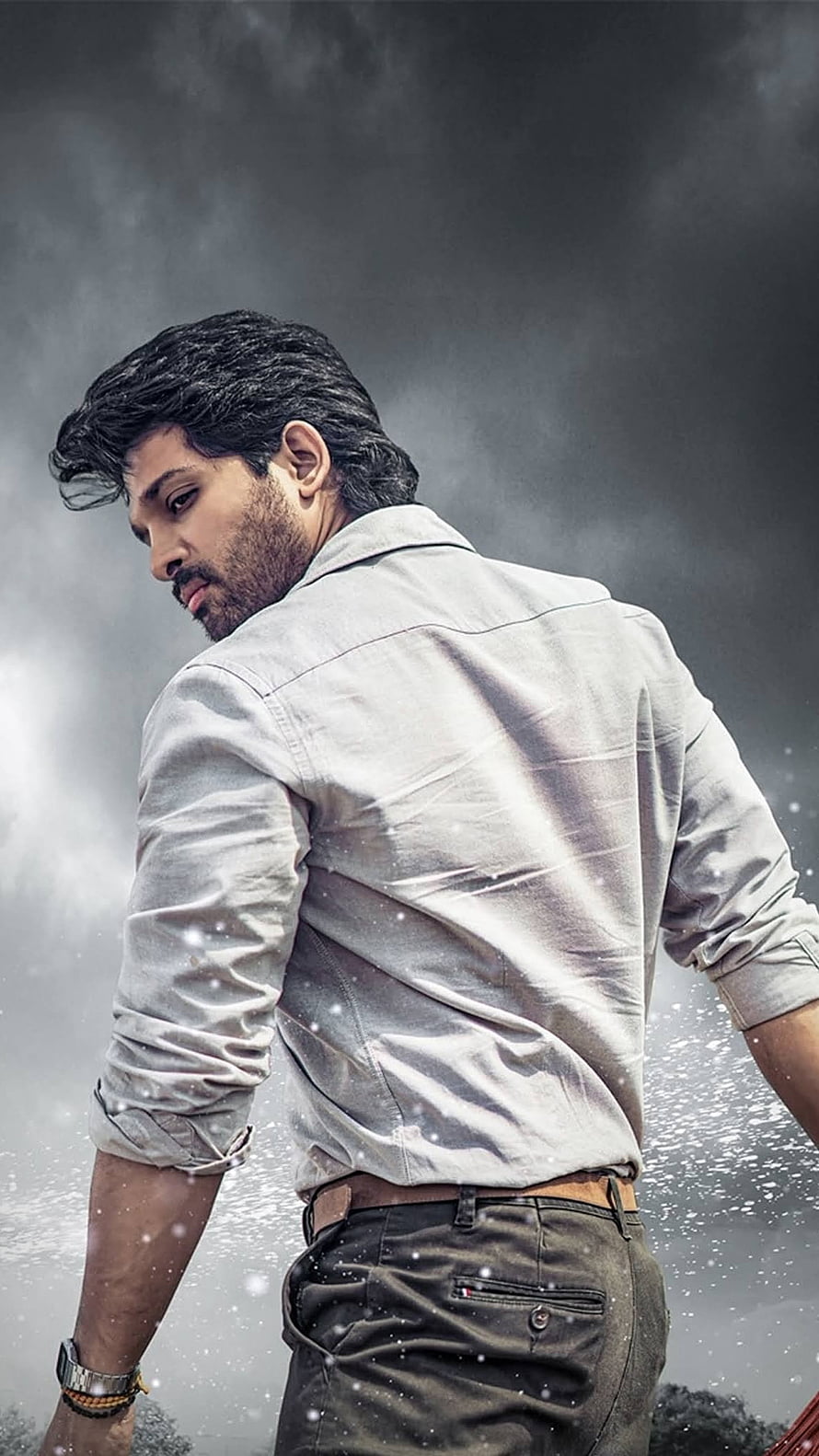Allu Arjun in Grey Shirt and Jeans Looking Back with Intense Gaze HD phone wallpaper