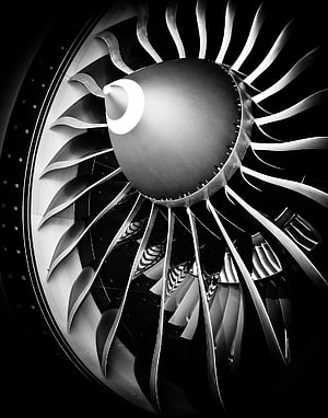 Monochrome Close-Up of a Boeing 777-300 Jet Engine Turbine Fan and Blades HD phone wallpaper