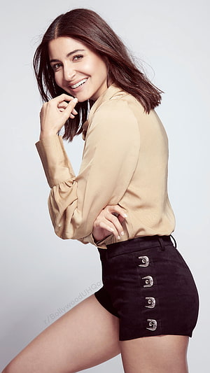 Anushka Sharma in Beige Blouse and Black Suede Shorts HD phone wallpaper