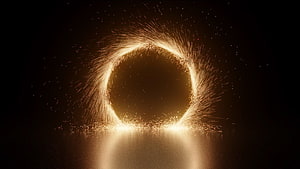 Golden Steel Wool Sparks Forming a Glowing Circle in the Dark HD wallpaper