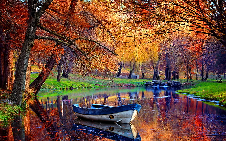 Serene Autumn River Scene With Wooden Boat And Vibrant Foliage Reflections HD wallpaper
