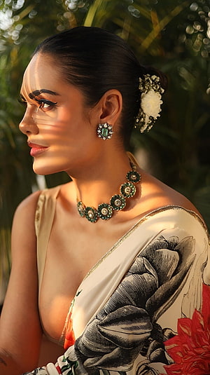 Esha Gupta in Floral Saree with Emerald Jewelry and Garden Backdrop HD phone wallpaper