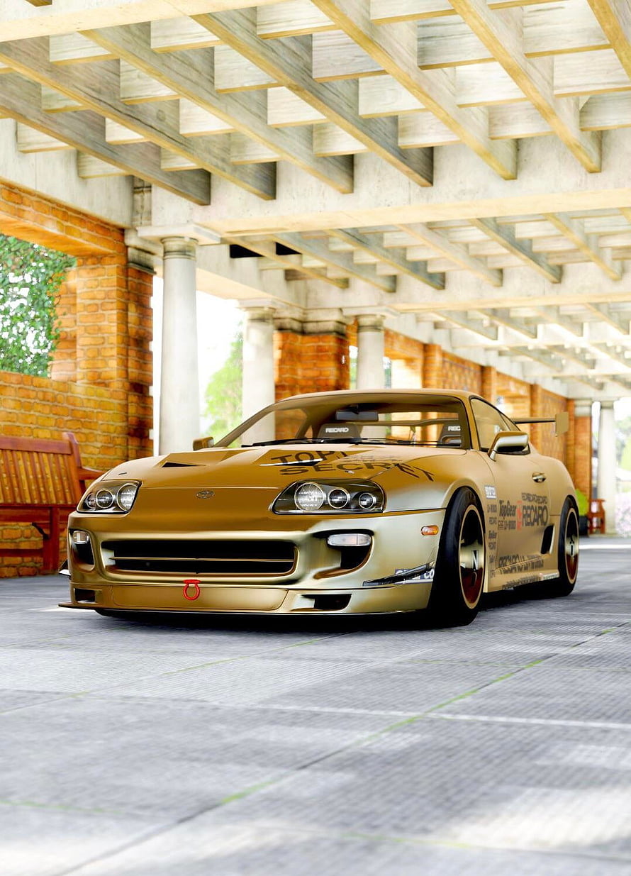 Gold Modified Toyota Supra MK4 with Top Secret Livery Parked Under a Concrete Pergola HD phone wallpaper