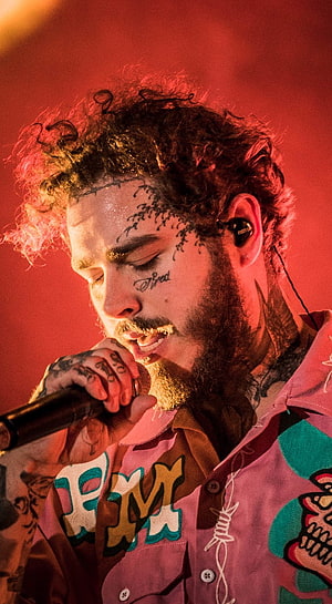 Post Malone Live Performance Portrait with Face Tattoos and Colorful Shirt HD phone wallpaper