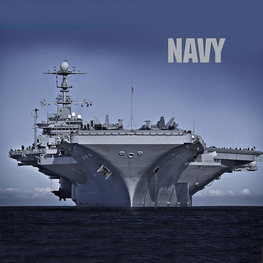 Frontal View of a Large Aircraft Carrier at Sea with Navy Text Overlay HD phone wallpaper