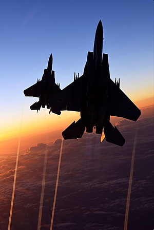 Silhouette of Two Fighter Jets Flying in Formation at Sunset HD phone wallpaper