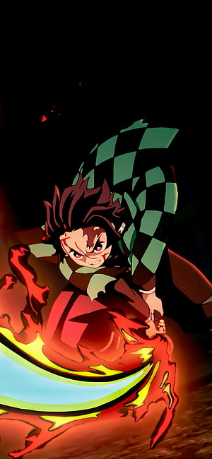 Tanjiro Kamado Wielding Hinokami Kagura Flame Sword Attack Anime Wallpaper HD phone wallpaper