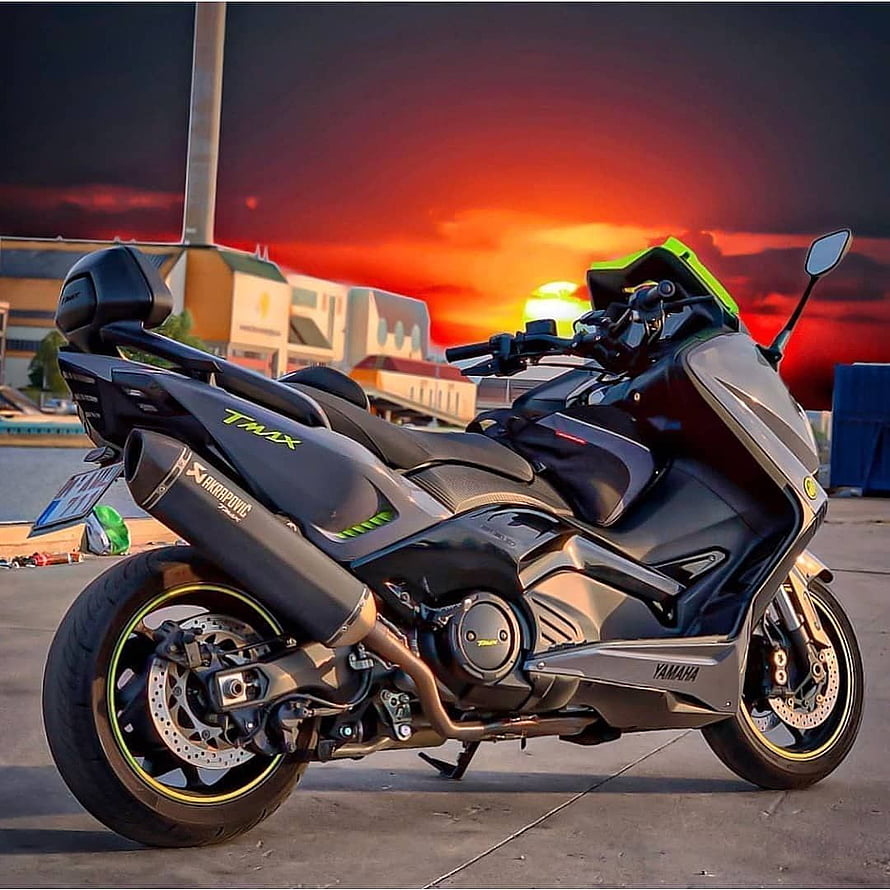 Yamaha TMax 530 Max-Scooter Parked Against a Dramatic Sunset Sky HD phone wallpaper