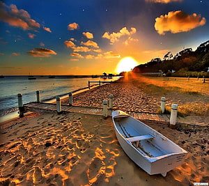 White Rowing Boat on Sandy Shore at Golden Sunset with Pier and Calm Sea HD wallpaper