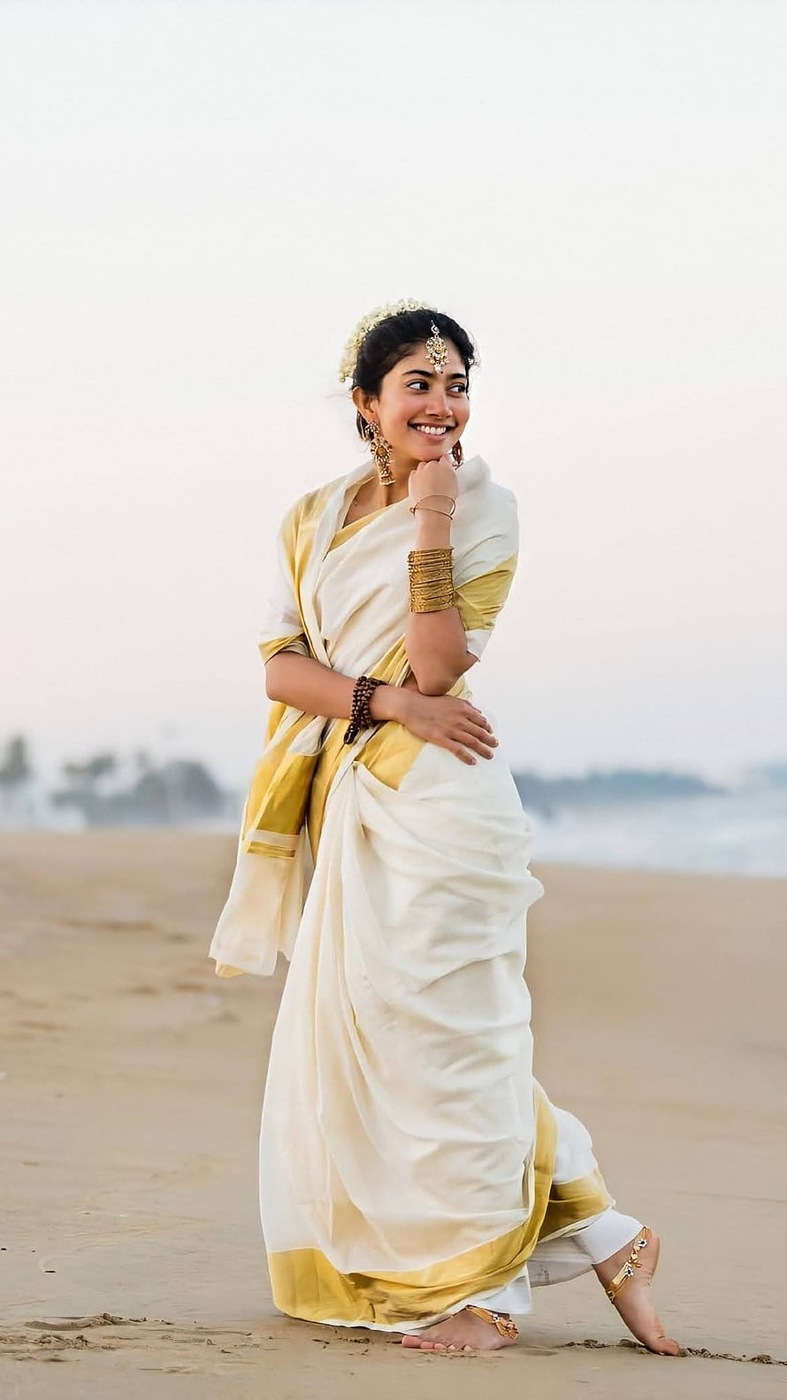 Woman in White and Gold Saree Walking on Sandy Beach, South Heroine, Sai Pallavi, Beautiful, Heroine HD phone wallpaper