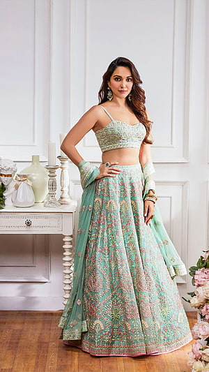 Elegant Mint Green Embroidered Lehenga Choli with Floral Patterns and Dupatta HD phone wallpaper