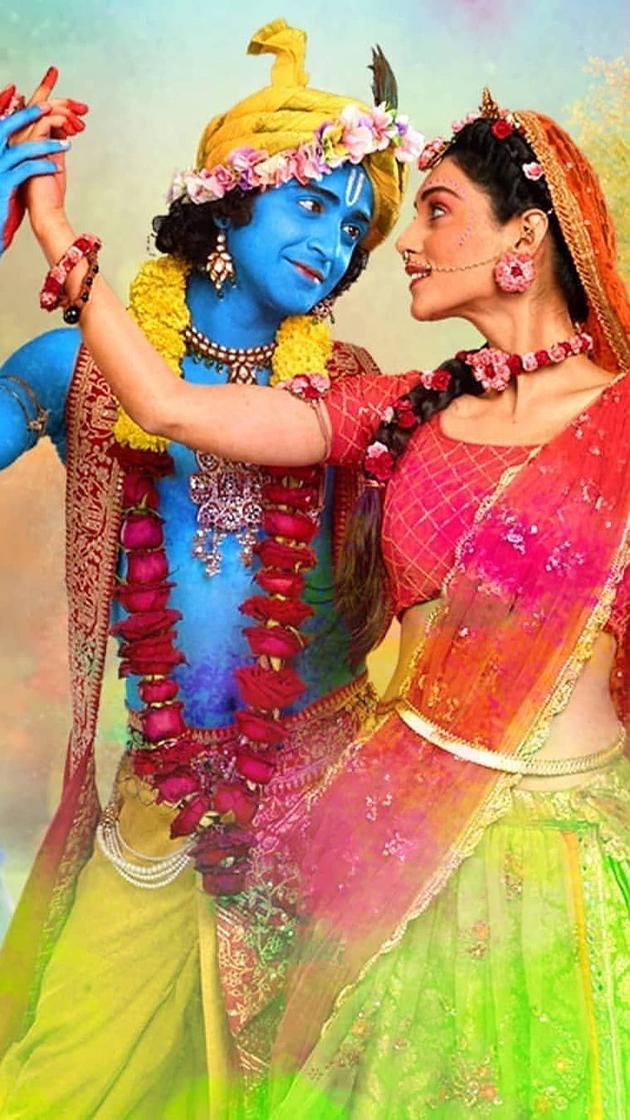 Radha and Krishna Dancing Together in Traditional Attire HD phone wallpaper