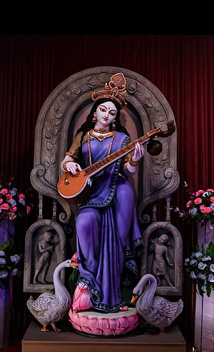 Saraswati Goddess Statue Playing Veena with Swans and Lotus HD phone wallpaper