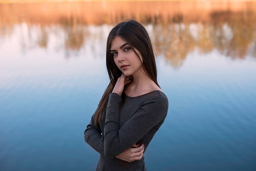 Portrait of a Young Woman with Long Dark Hair Standing by a Lake at Sunset, Cute, brunette, girl model, lake HD wallpaper