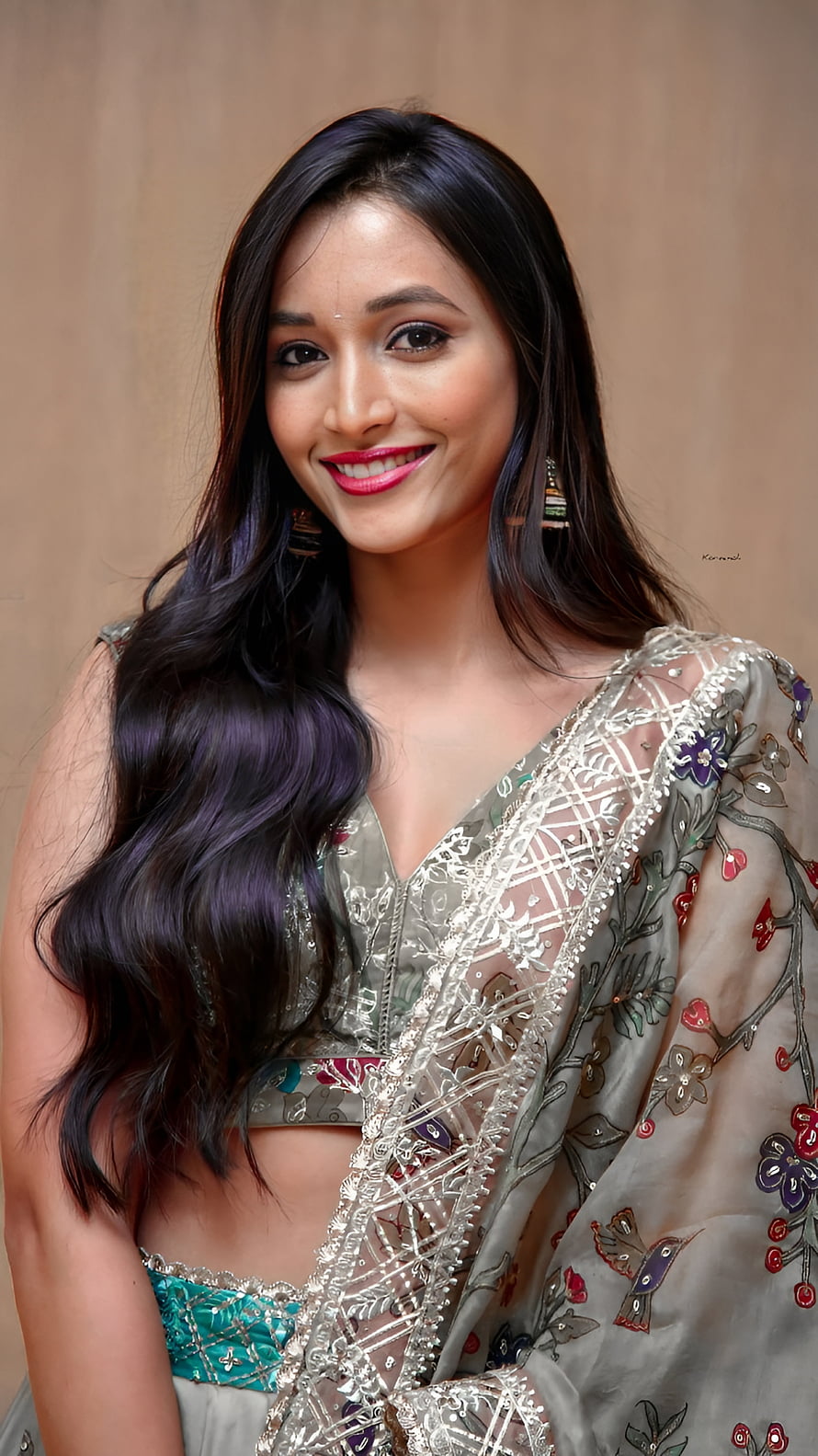 Srinidhi Shetty in an embroidered silver lehenga with floral motifs and long wavy hair HD phone wallpaper