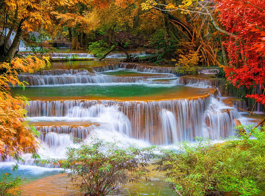 Vibrant Autumn Waterfall Cascading Through Colorful Forest Foliage HD wallpaper