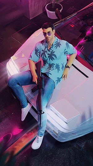 Tommy Vercetti in a Hawaiian shirt holding an assault rifle on a white car under neon lights HD phone wallpaper