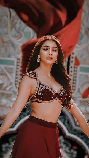 Pooja Hegde in a stunning maroon traditional outfit with intricate gold embroidery and jewelry HD phone wallpaper