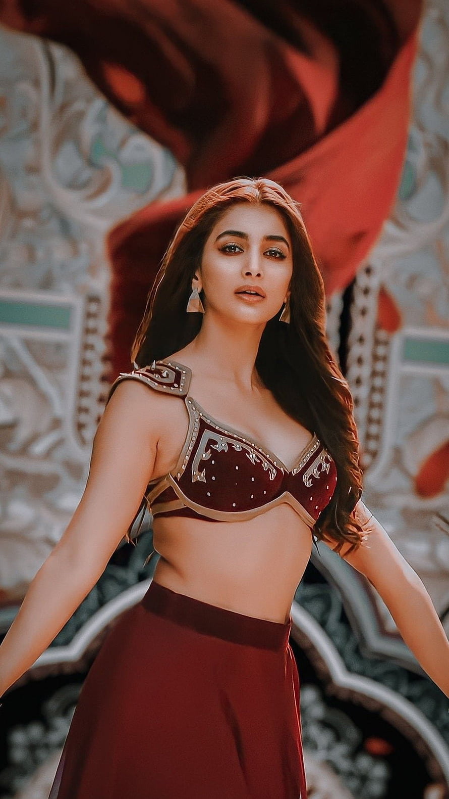 Pooja Hegde in a stunning maroon traditional outfit with intricate gold embroidery and jewelry HD phone wallpaper