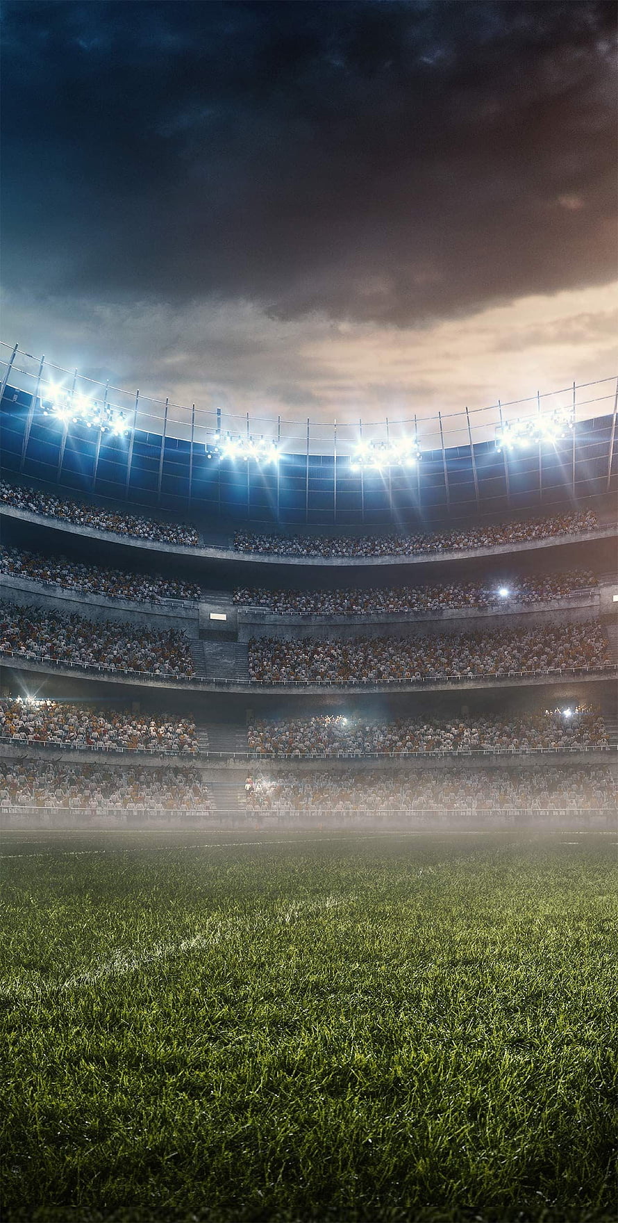 Atmospheric Night View of a Packed Football Stadium with Bright Floodlights HD phone wallpaper