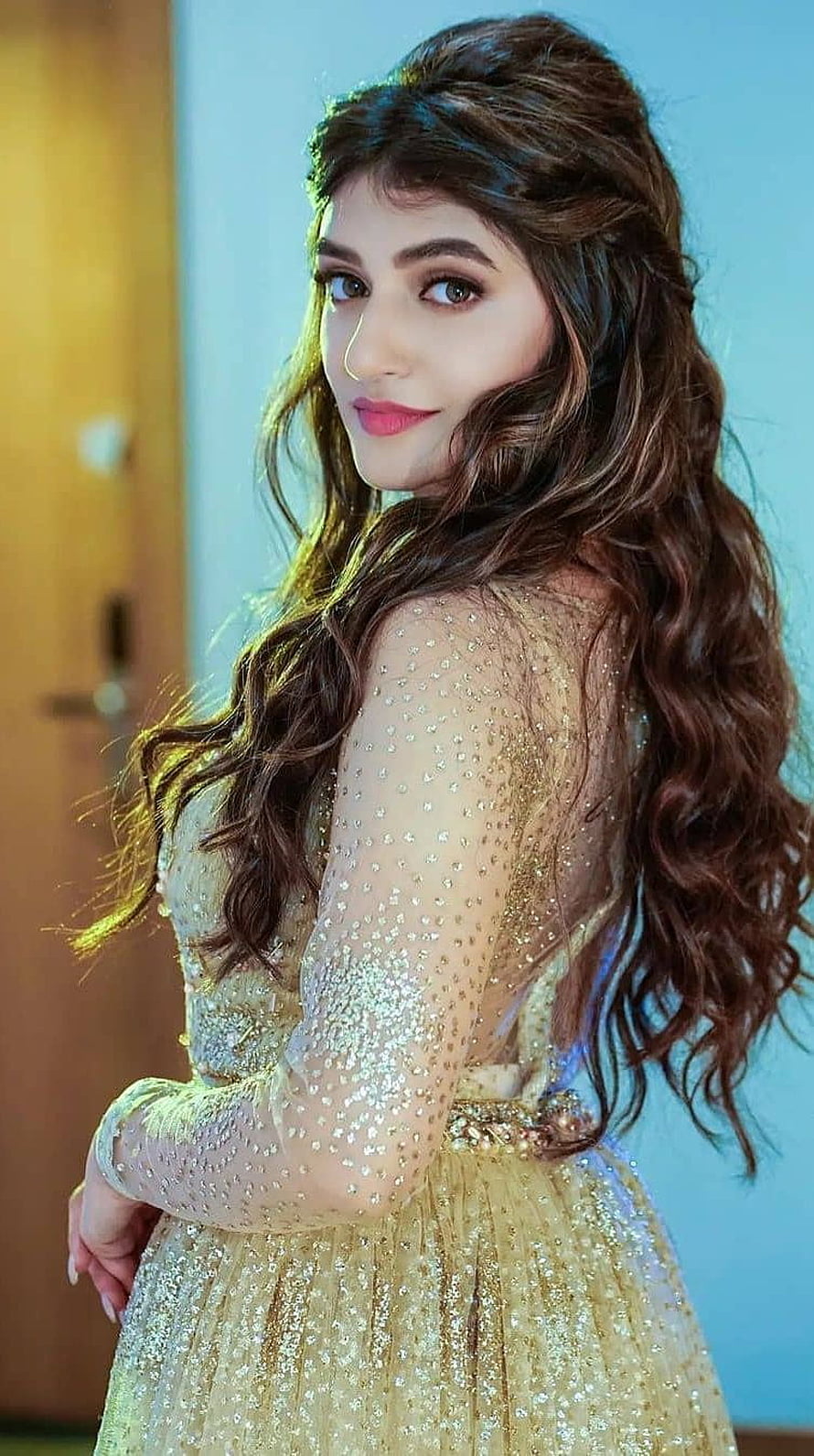 Zaira Wasim in a Glittering Gold Sequin Gown with Wavy Hair HD phone wallpaper