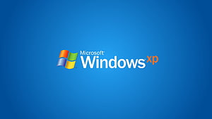 Microsoft Windows XP Logo on Classic Blue Gradient Background HD wallpaper