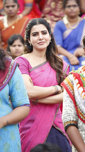 Samantha Akkineni in a vibrant pink sari at a public event with arms crossed HD phone wallpaper