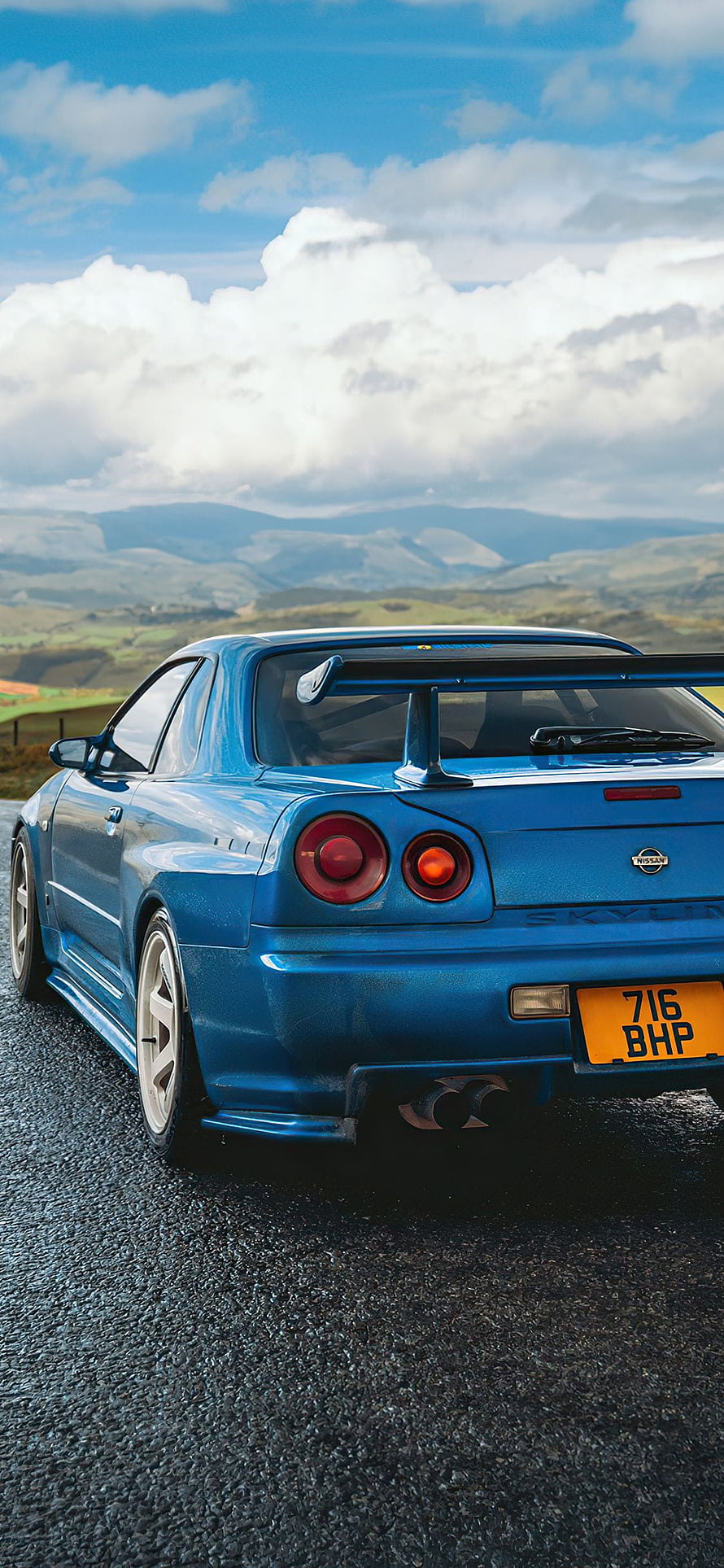 Blue Nissan Skyline GT-R R34 Rear View on Mountain Road HD phone wallpaper