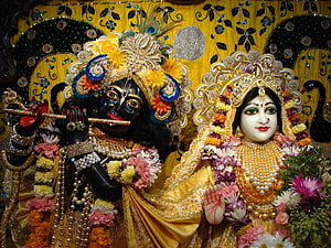 Radha Krishna Deities Adorned in Flowers and Jewels HD wallpaper