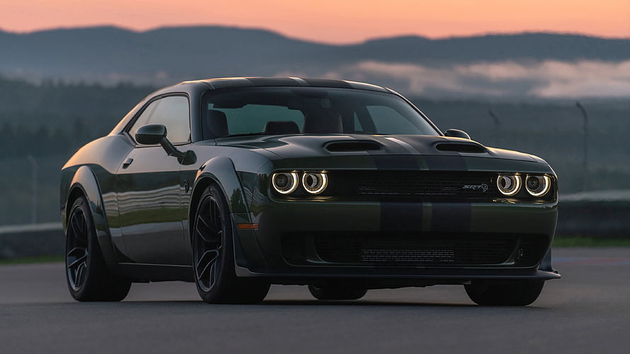 Dodge Challenger SRT Demon 170 in dark green with racing stripes on a track at sunset HD wallpaper