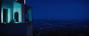 La La Land Rooftop Scene Over Nighttime City Skyline HD wallpaper