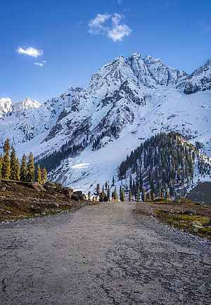 Snow-Capped Himalayan Peaks and Alpine Road in Jammu and Kashmir HD phone wallpaper