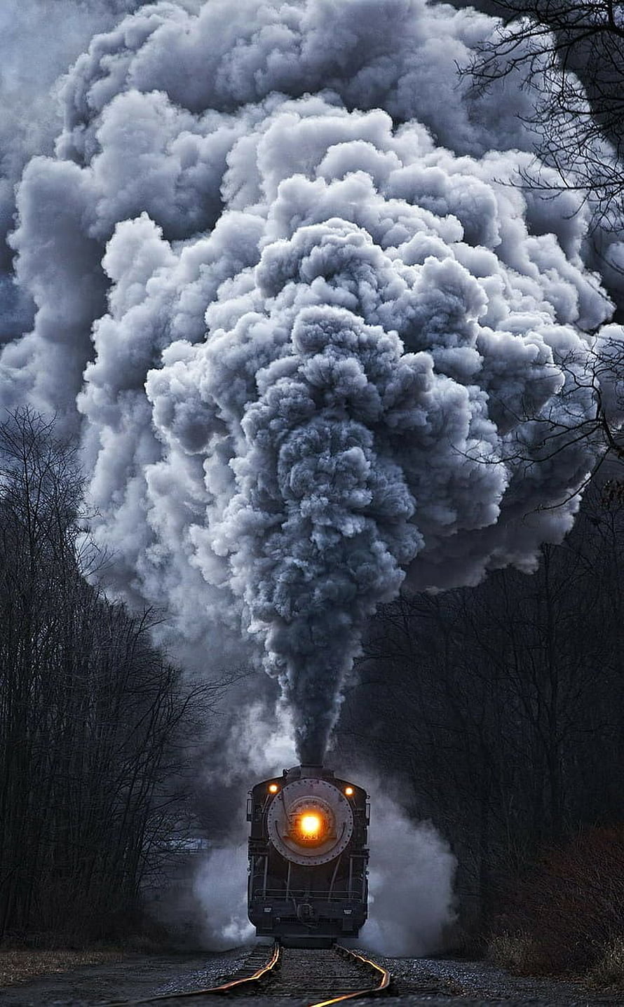 Vintage Steam Locomotive Billowing Smoke Through a Dark Forest HD phone wallpaper
