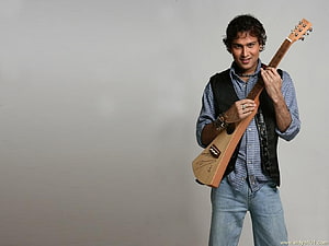 Zubeen Garg Holding Acoustic Guitar in Studio Portrait HD wallpaper