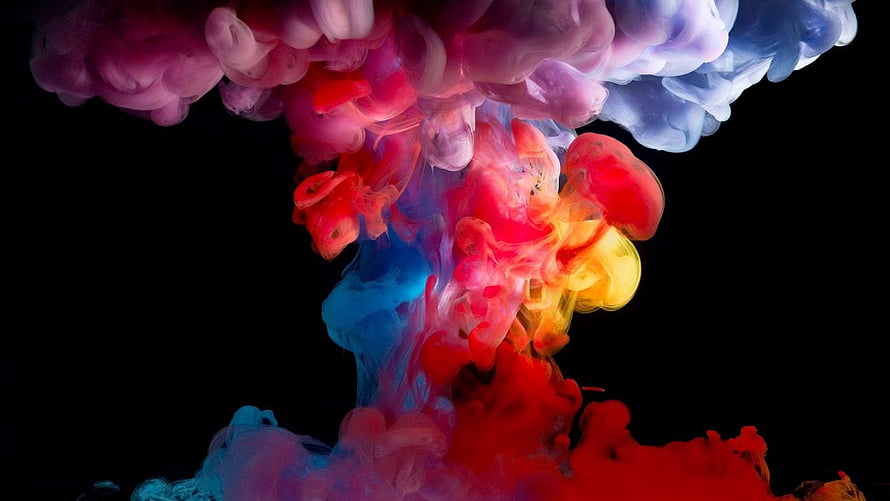 Vibrant Multicolored Ink Clouds Swirling in Water Against Black Background HD wallpaper