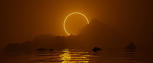 Ring of Fire Solar Eclipse Over Silhouetted Mountains and Ocean Water HD wallpaper