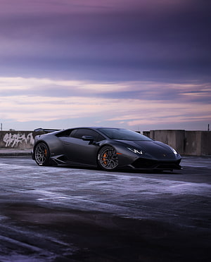 Matte Black Lamborghini Huracan ST-Parked on Wet Asphalt at Dusk HD phone wallpaper