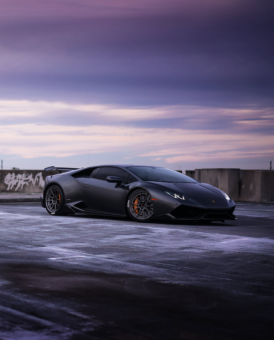 Matte Black Lamborghini Huracan ST-Parked on Wet Asphalt at Dusk HD phone wallpaper