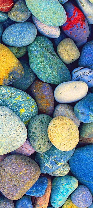 Vibrant Multicolored Pebbles and Smooth Stones in Blue, Green, and Yellow Tones HD phone wallpaper