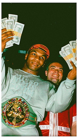 Mike Tyson Celebrating Victory with Cash and World Championship Belt HD phone wallpaper